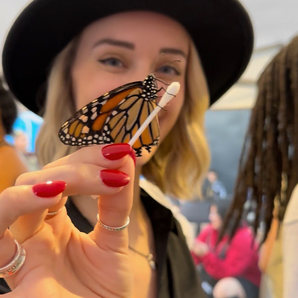 Woman holding butterfly